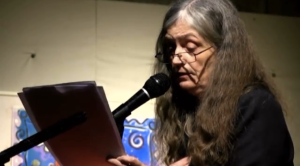 Alice Notley, still from Poetry Center Archives color video recording of her reading, December 1, 2012, at the Unitarian Center, San Francisco