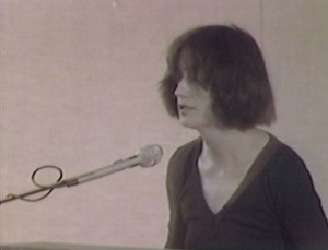 Alice Notley, still from Poetry Center Archives color video recording of her reading, May 3, 1984, at San Francisco State University
